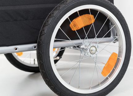 Schwarzer und roter Fahrradanhänger von Trixie für Haustiere